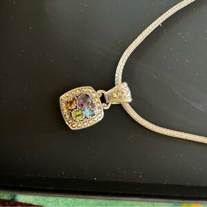 Silver Pendant Necklace with Intricate Design and Colorful Gemstones